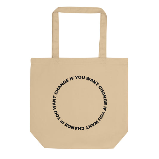 Black text loop reading change if you want change wrapped in a circle on a small organic cotton tote bag