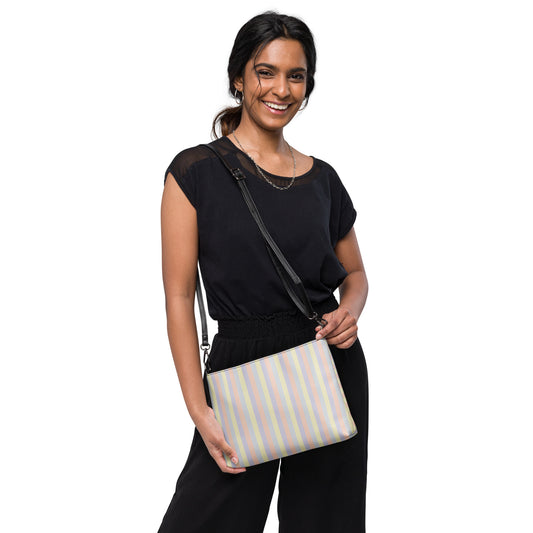 Faux leather crossbody bag with abstract pastel color panel print, dark gray hardware and zip-top closure