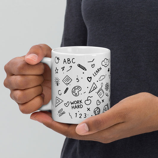 11oz white glossy mug with hand-drawn school doodle print — close-up of illustrated details