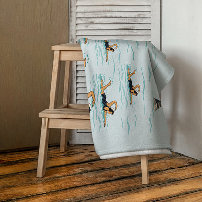 Vintage swim team beach towel shown in small and large sizes
