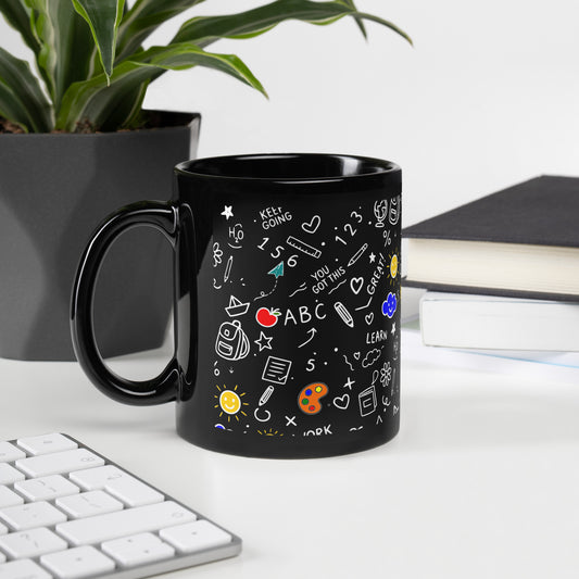 School doodle black mug on a desk — back to school gift for teachers and students, shown in 11 oz size