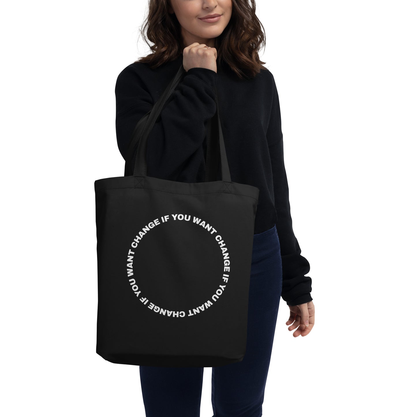 Organic cotton eco tote bag with white circular quote design, carried over the shoulder