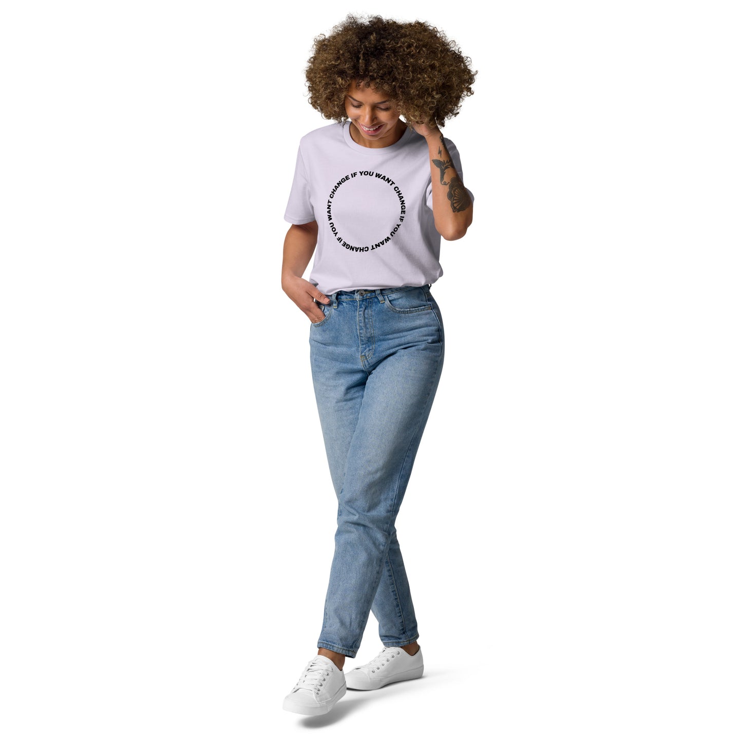 Woman wearing the organic cotton t-shirt with black circular quote "Change if you want change"