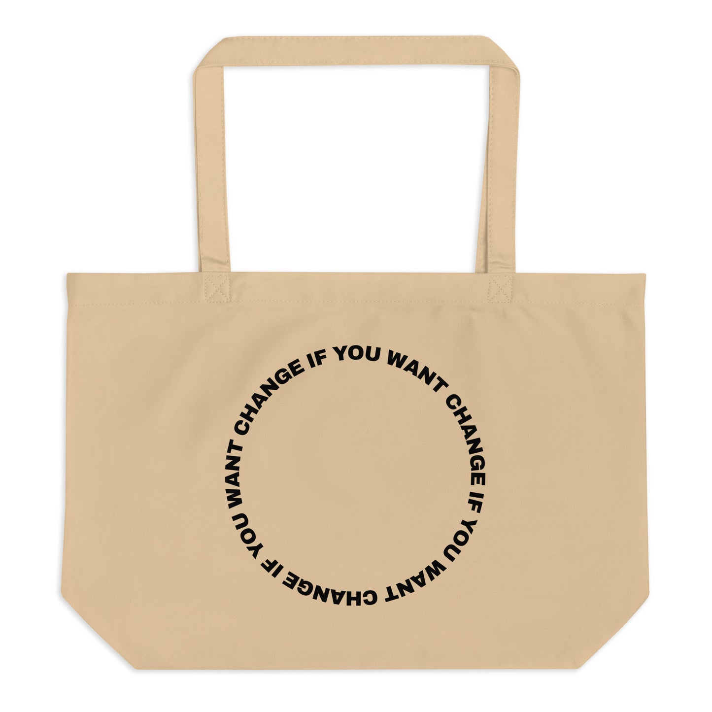Black text in loop: "change if you want change" wrapped in a circle on an organic cotton tote bag