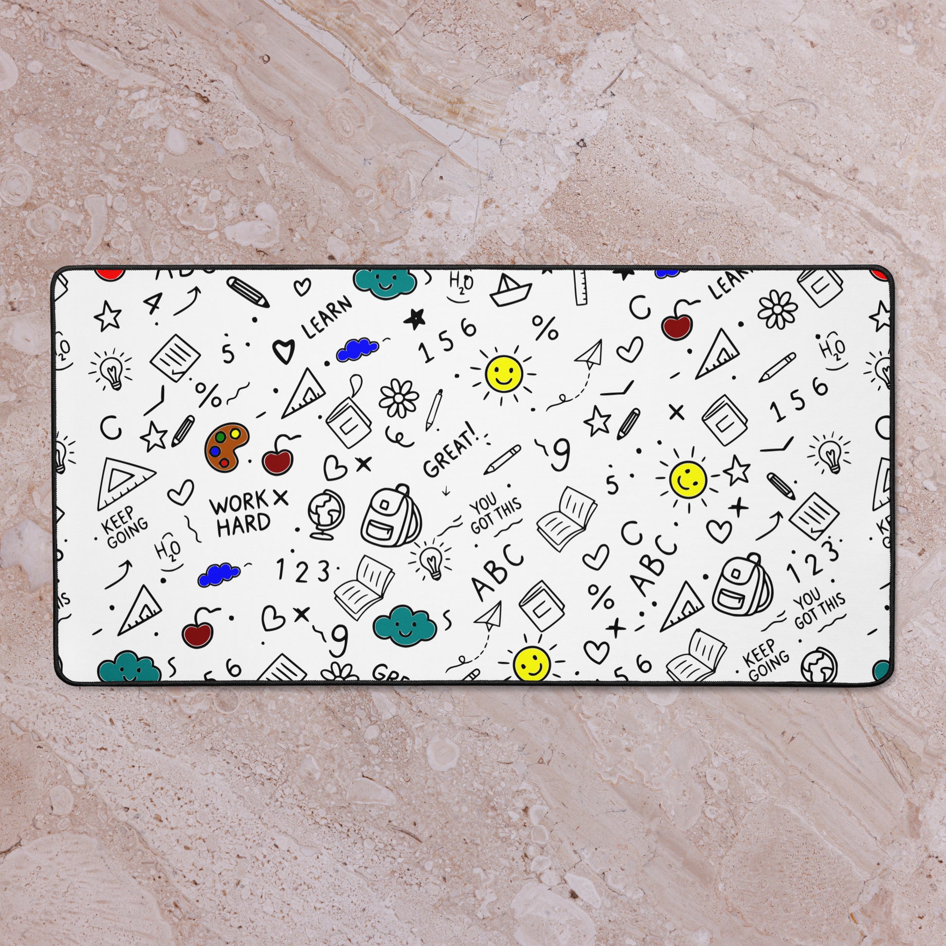 Desk mat with colorful hand-drawn school doodle illustration — books, pencils, numbers and happy faces on a smooth polyester surface