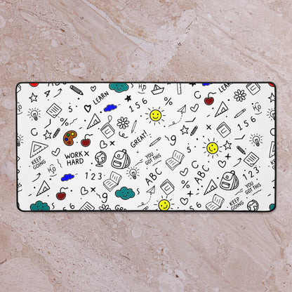 Desk mat with colorful hand-drawn school doodle illustration — books, pencils, numbers and happy faces on a smooth polyester surface