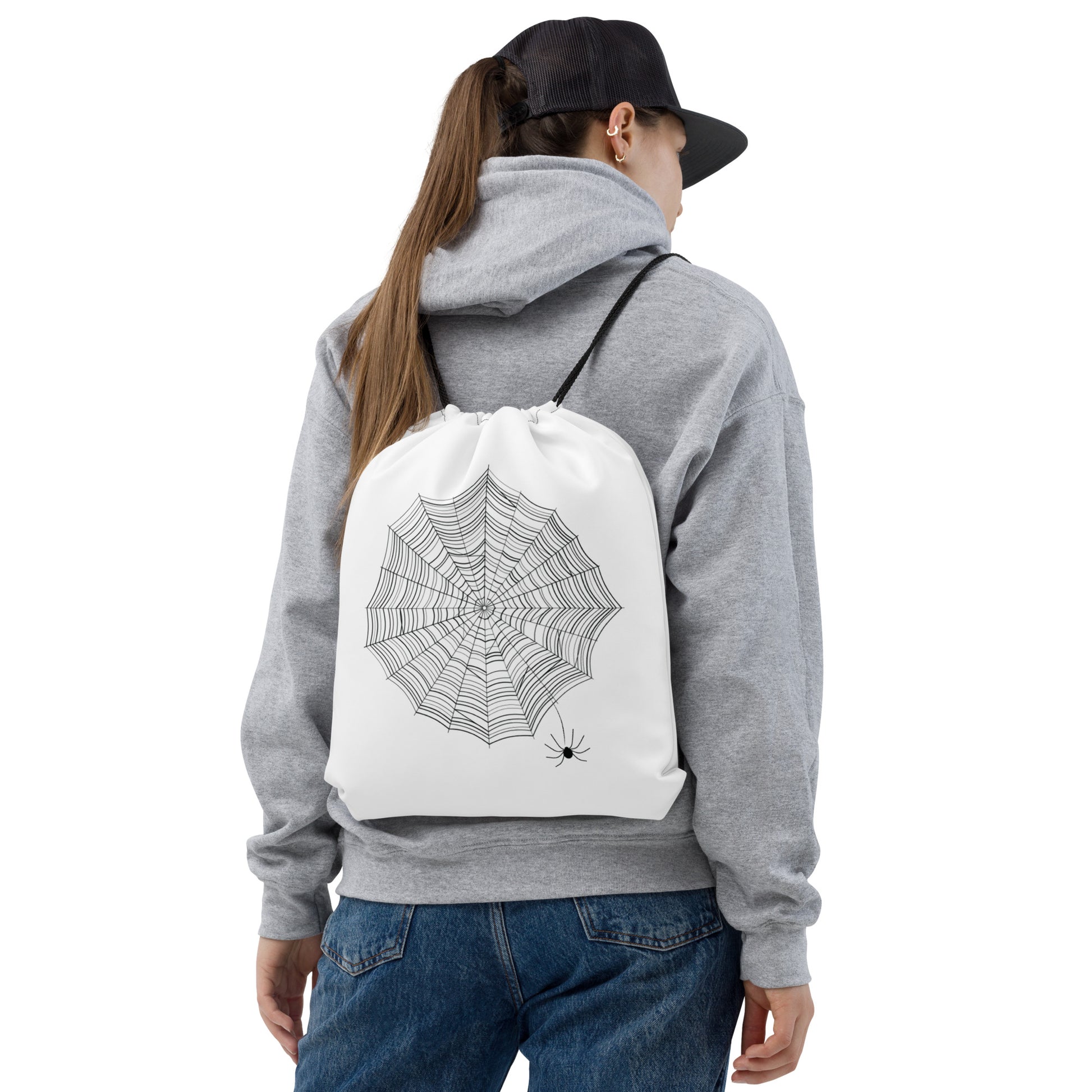 Find the Spider drawstring bag — all-over black spiderweb print on white polyester gym bag with hidden spider detail