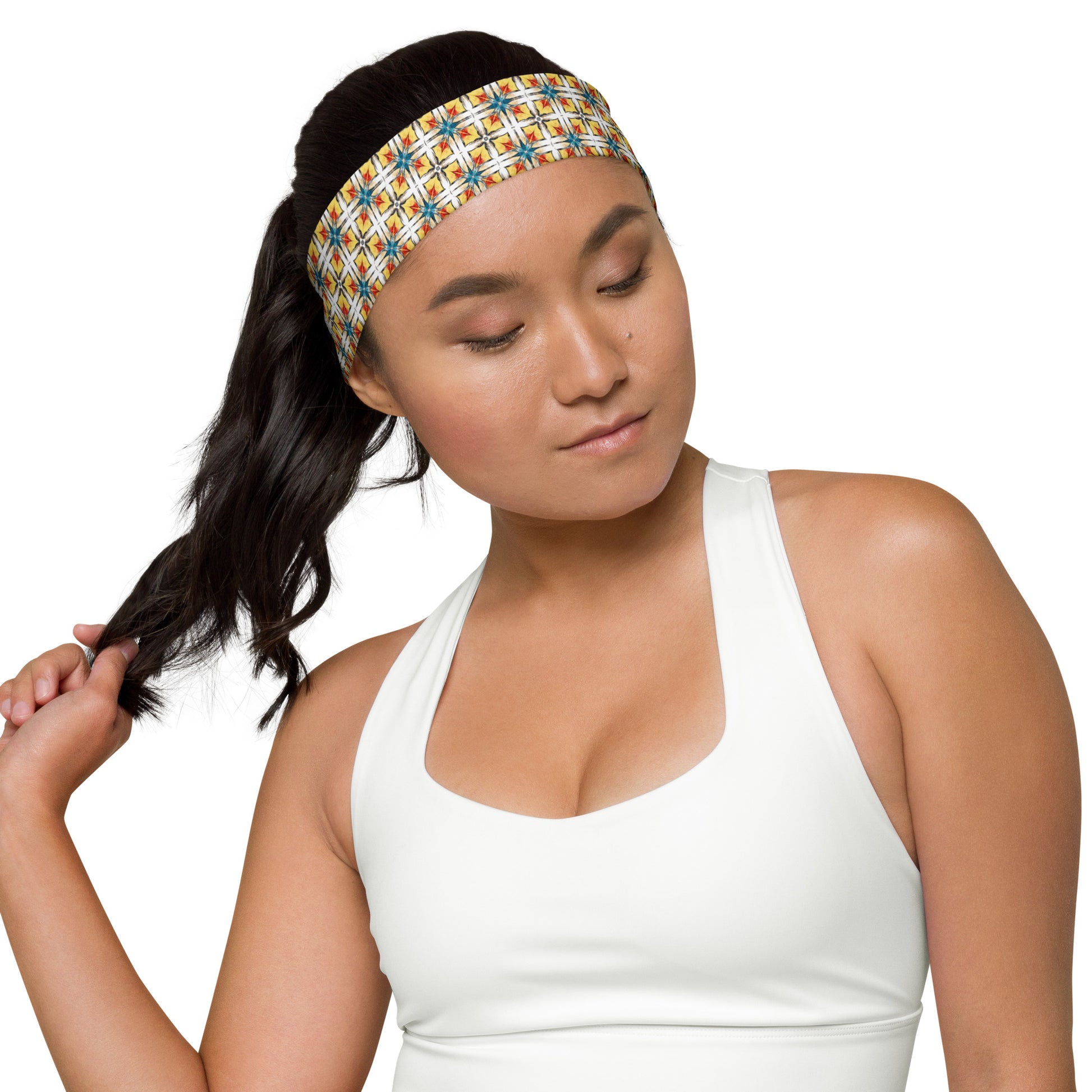 Close-up of Fuego & Flow headband showing bold geometric print detail and soft fabric