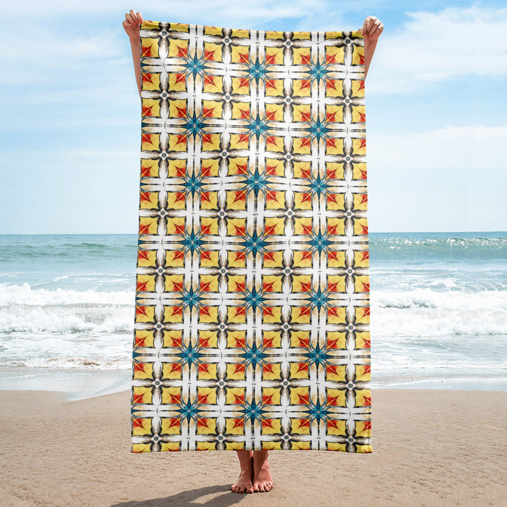 Close-up of Fuego & Flow towel showing hand-drawn geometric tile pattern in bold color