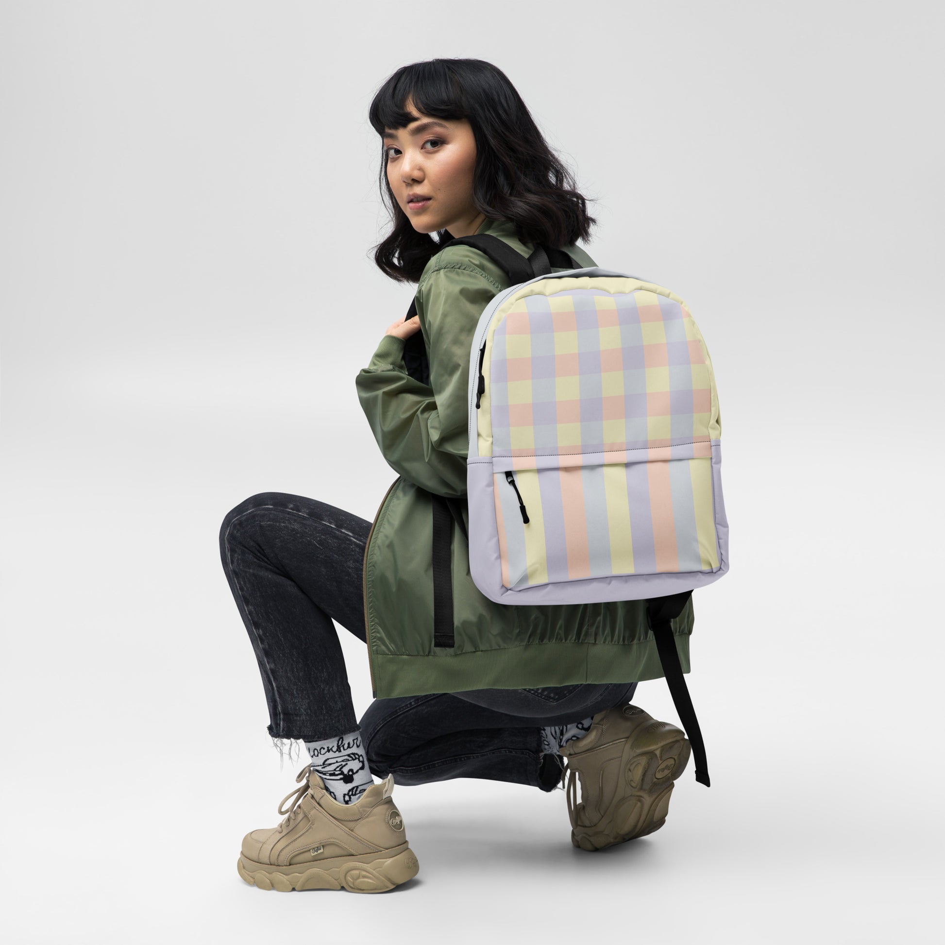 Just Color backpack with pastel colorblock all-over print — Lemon Icing, Nimbus Cloud, Peach Dust, and Orchid Tint, water-resistant polyester