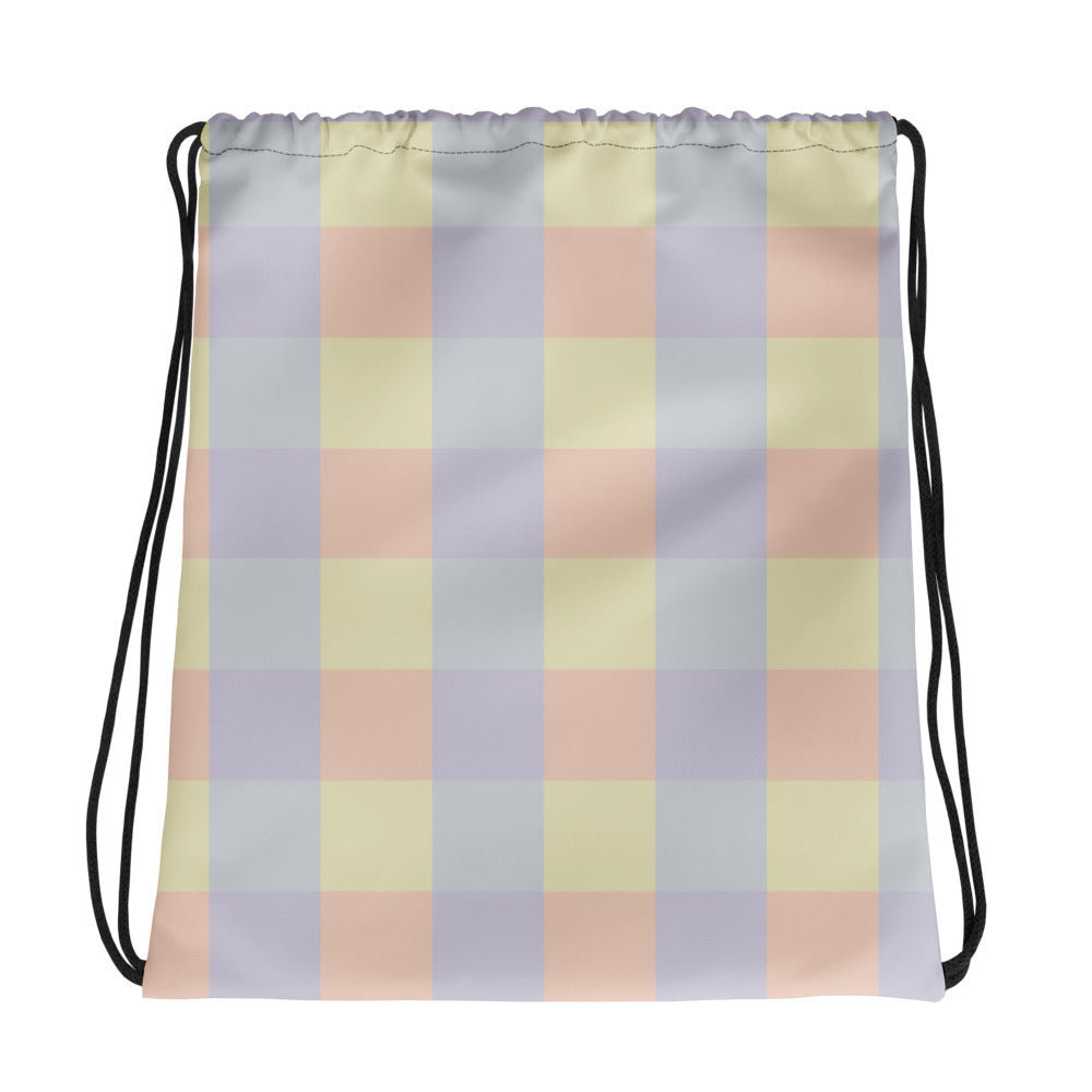 Pastel abstract print drawstring backpack in soft yellow, lavender, peach, and grey color panels, cotton handles