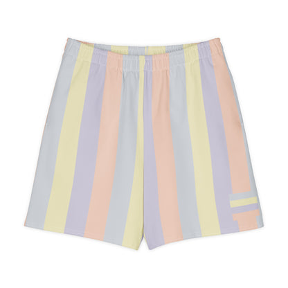 Long shorts in pastel color panels, soft yellow, lavender, peach, and grey tones, relaxed unisex fit, front view.