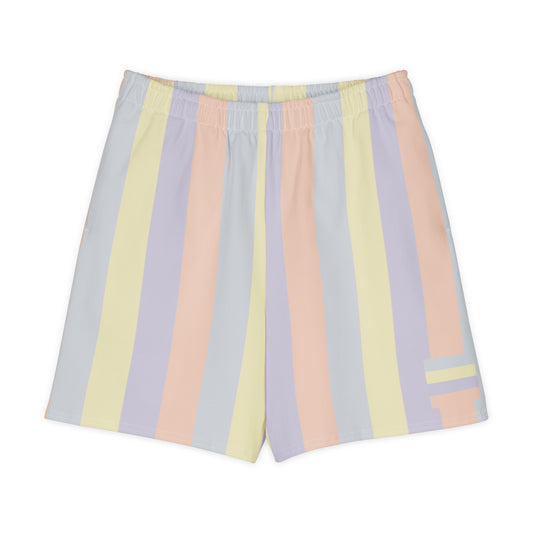 Long shorts in pastel color panels, soft yellow, lavender, peach, and grey tones, relaxed unisex fit, front view.