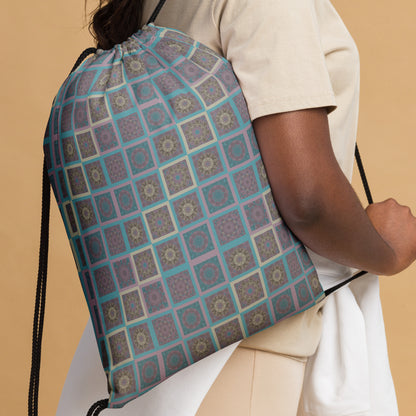 Mandala tiles drawstring bag worn as backpack — kaleidoscopic geometric print in turquoise and mauve