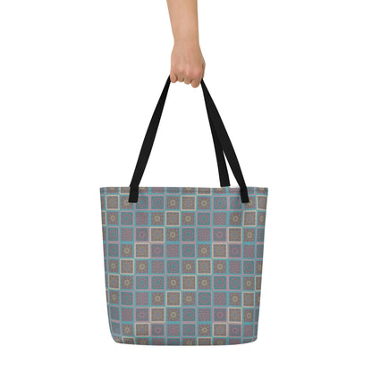 Mandala tiles tote bag held at shoulder — kaleidoscopic sacred geometry print in turquoise and mauve