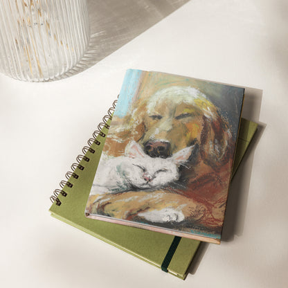 Hardcover matte journal featuring a soft pastel drawing of a golden retriever and white cat napping together — by artist Lena Kloper