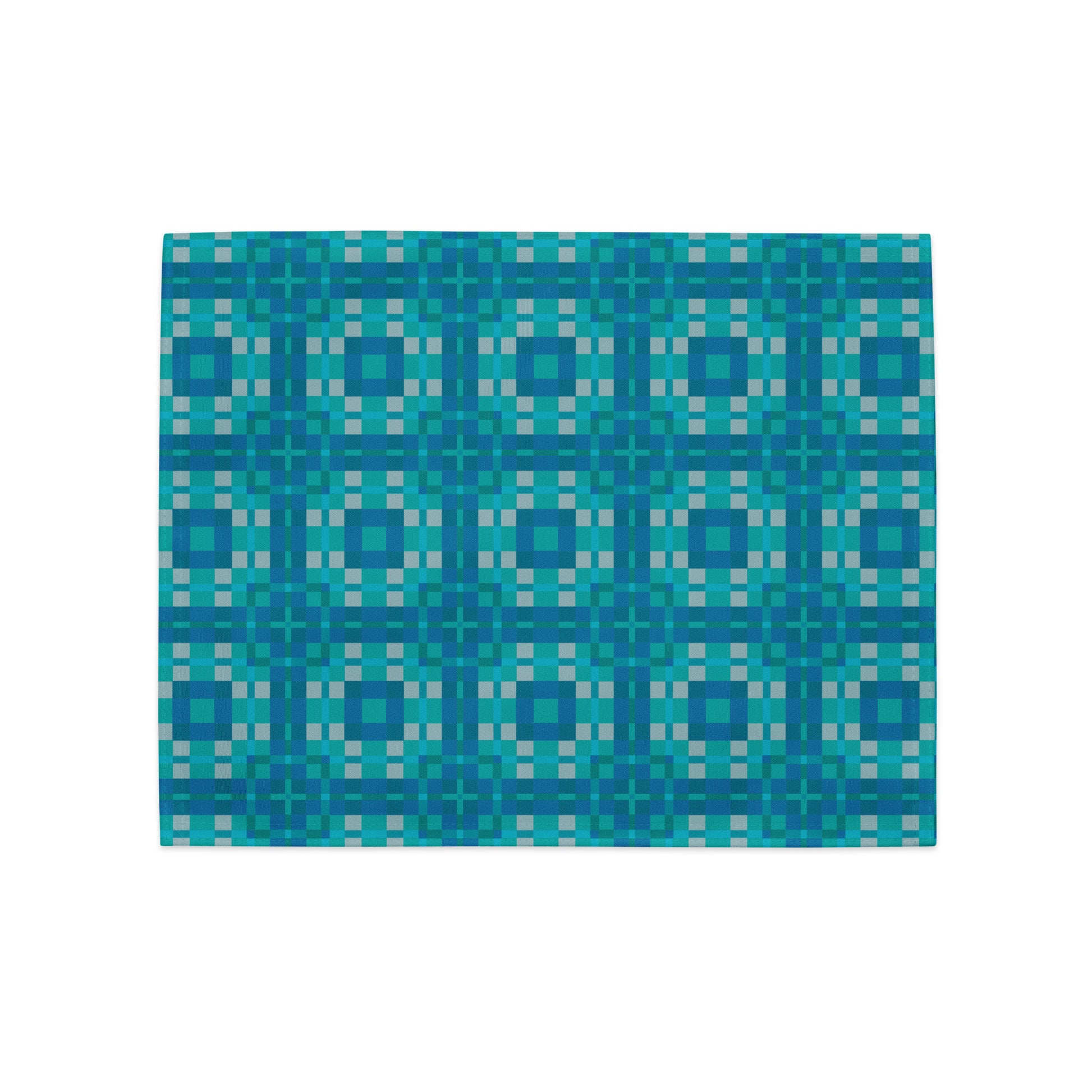 Close-up of Pixel Azulejo placemats showing distinct teal and turquoise geometric pixel art tile designs