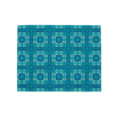 Close-up of Pixel Azulejo placemats showing distinct teal and turquoise geometric pixel art tile designs