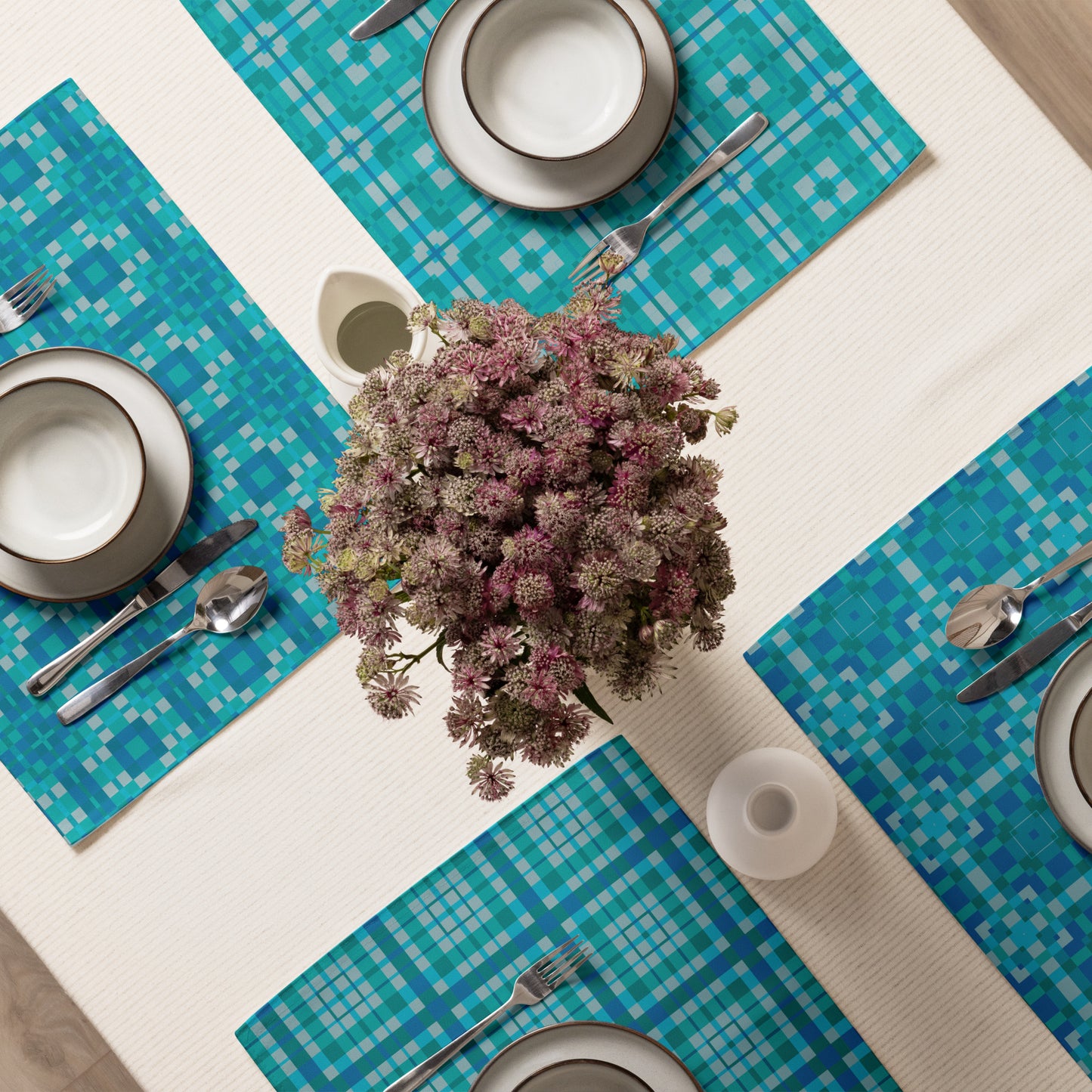 Pixel Azulejo placemat set of four with turquoise geometric tile pattern on a dining table