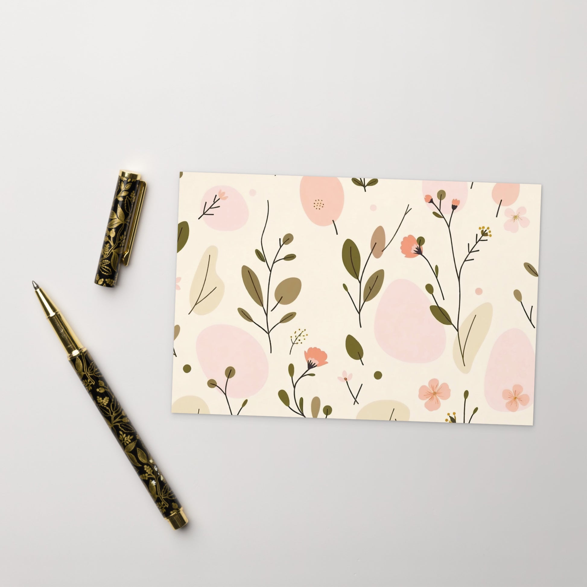 Soft Bloom floral postcard horizontal styled flat lay — matte cardboard with soft pink botanical print