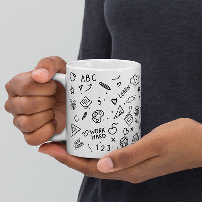11oz white glossy mug with hand-drawn school doodle print — close-up of illustrated details