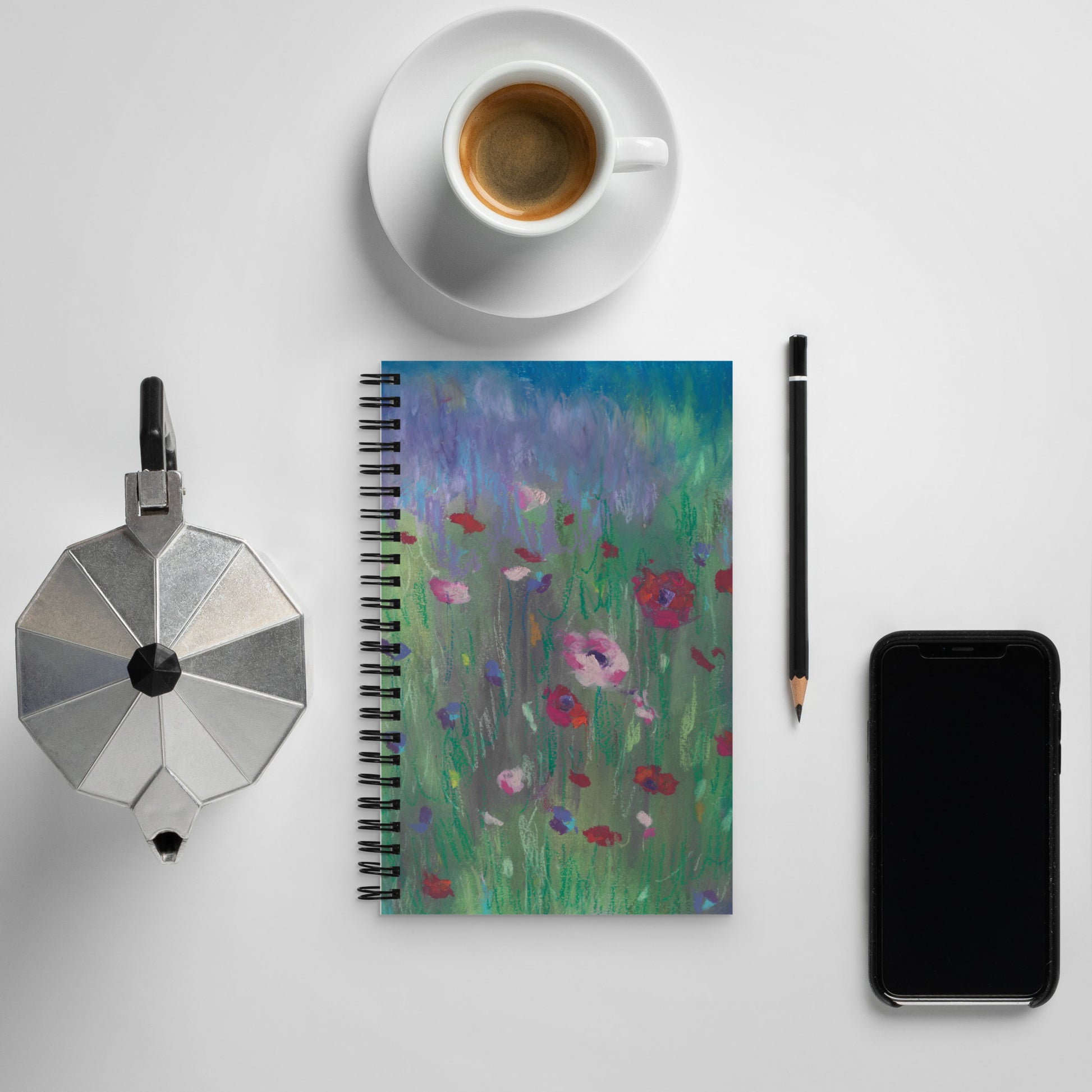 Wire-bound dotted notebook open to dot grid pages, pastel wildflower cover art, soft-touch laminated finish